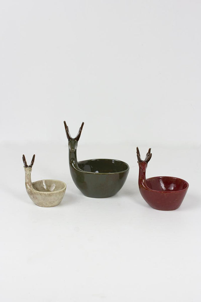 set of 3 ceramic deer bowls of different sizes in green, red and off-white colors - front view
