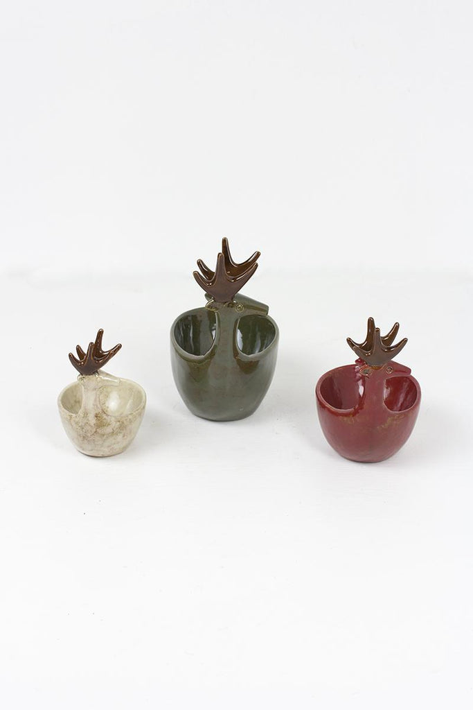 set of 3 ceramic deer bowls of different sizes in green, red and off-white colors - left side view