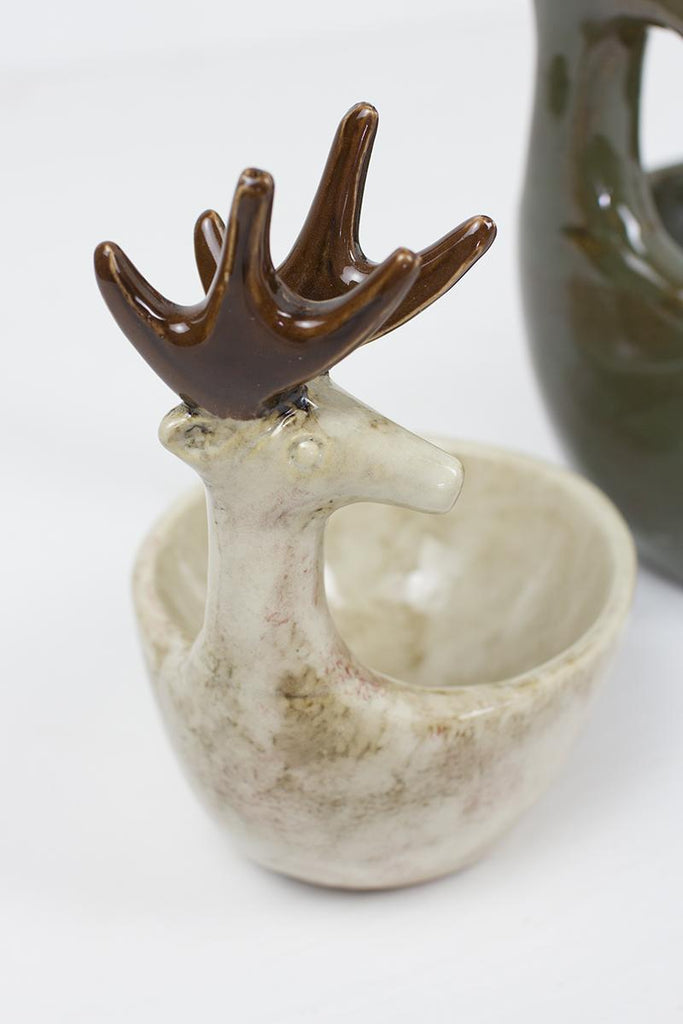 close-up of off-white marble color deer head and bowl