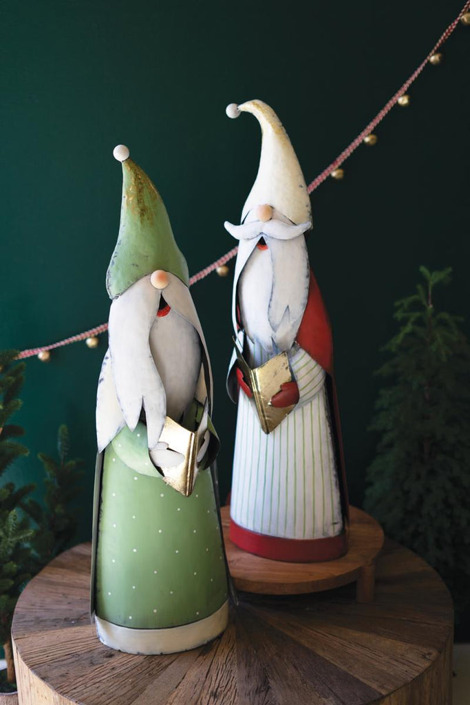 set of 2 caroling santas - one with green cloak, another with a white cloak, blue stripes and a red cape