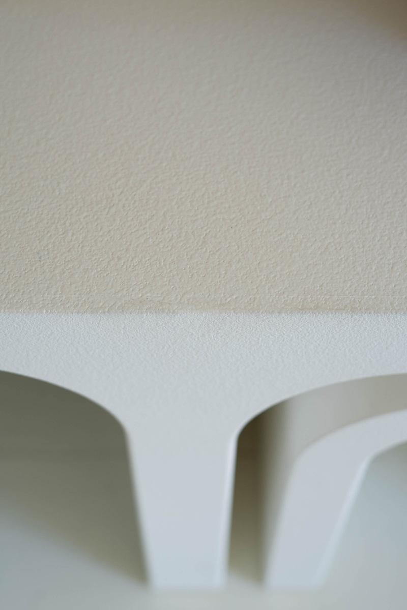 elevated closeup of white wood texture from top middle of coffee table