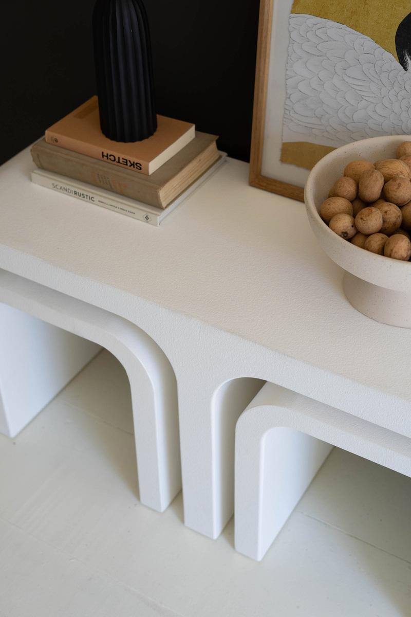 angled top down view of coffee tables peacefully nested within the larger table