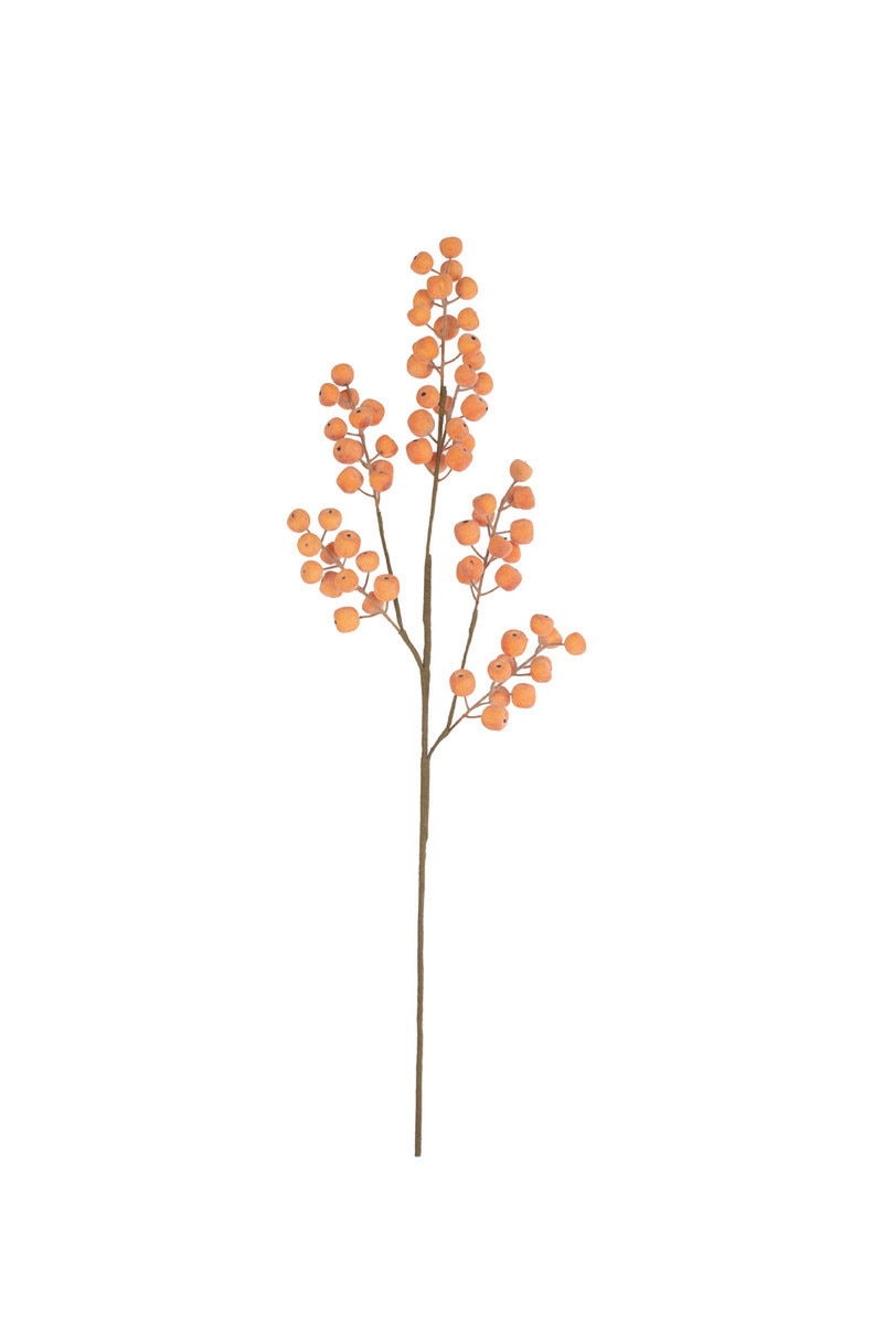 An artificial decorative branch with clusters of small orange berries on a thin brown stem, isolated on a white background.