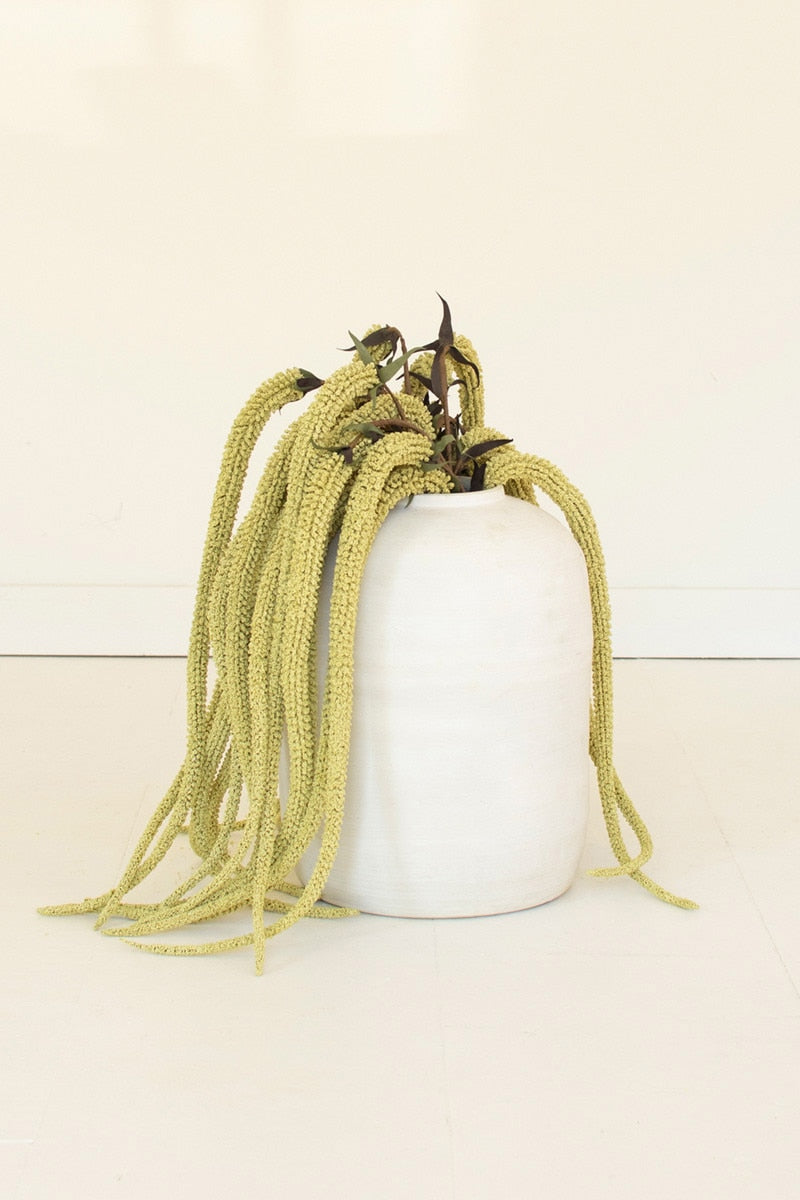 Potted artificial amaranthus plant with long, hanging yellow leaves on a white background