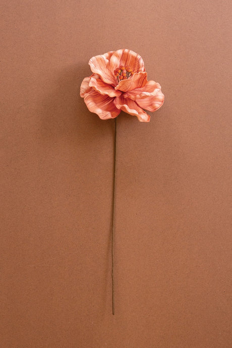 beautiful orange white artificial blossom on long stem