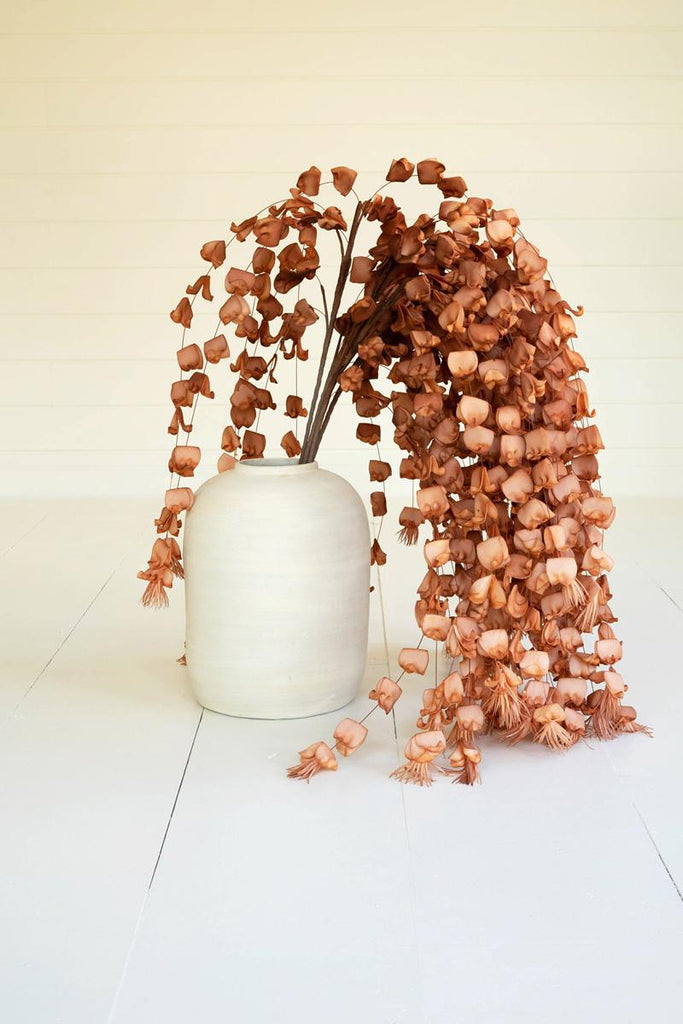 artificial plant with numerous light brown blossoms made with latex rubber - shown in white pot