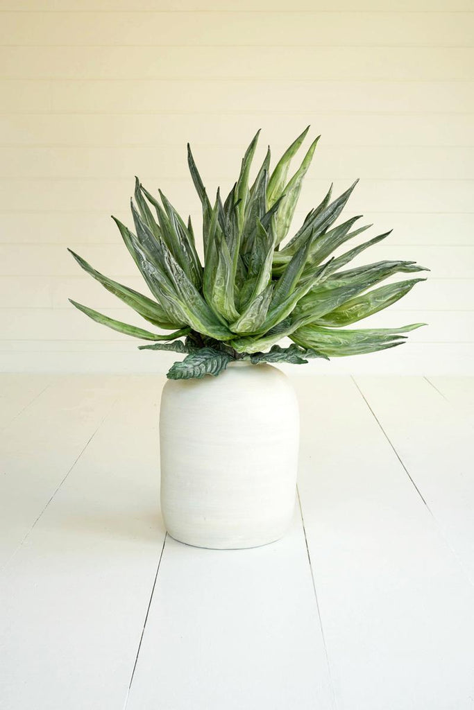 artificial plant with vivid green leaves made with latex rubber - shown in white pot