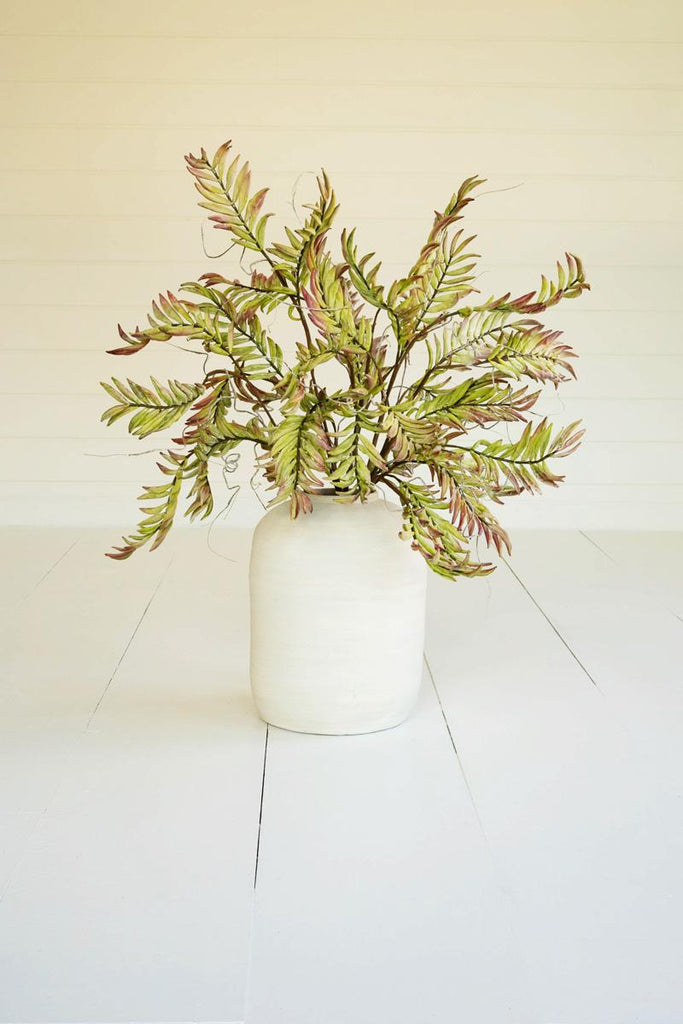 artificial plant with green branches and leaves made with latex rubber - shown in white pot