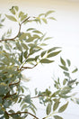 artificial plant with multiple branches and green leaves made with latex rubber - close-up view