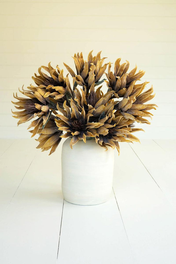 artificial plant with light brown flowers made with latex rubber - shown in white pot