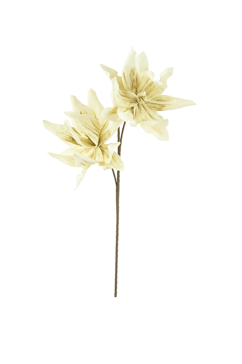 Two beige artificial flowers on a white background