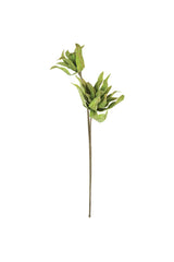 Artificial green leaf branch on a white background