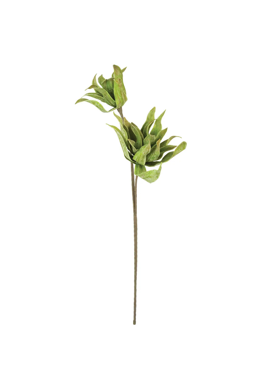 Artificial green leaf branch on a white background