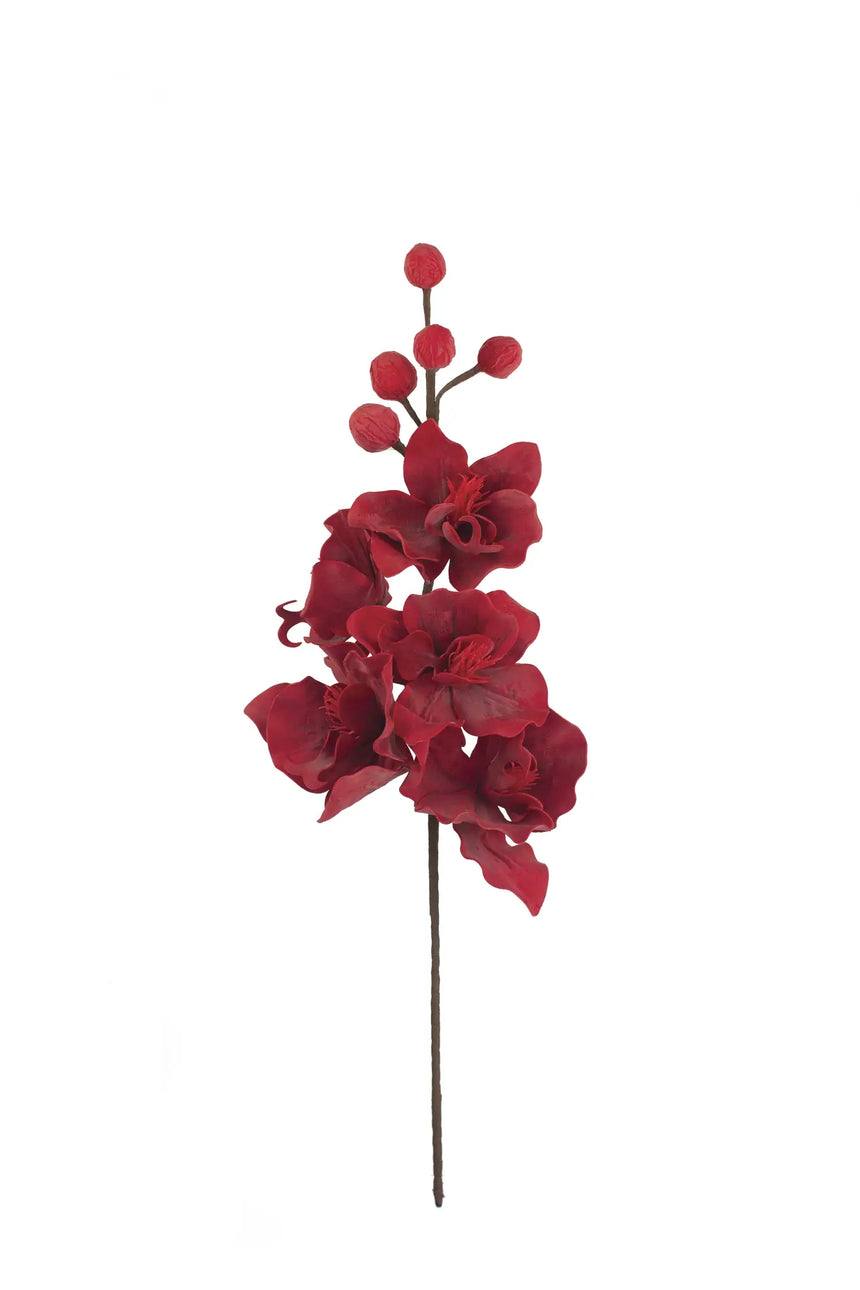 A single artificial red orchid stem with multiple red blossoms and small round red buds on a dark stem, isolated on a plain white background.