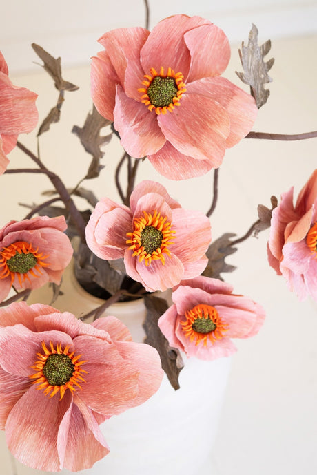 Delicate pink blooms and softly curved stems give this faux floral stem a romantic garden-inspired feel