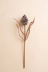 This sculptural faux stem features a textured pinecone-inspired accent paired with delicate branching details for a naturally collected woodland look.