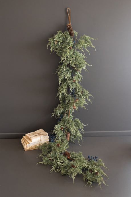 Long faux evergreen garland with pine cones