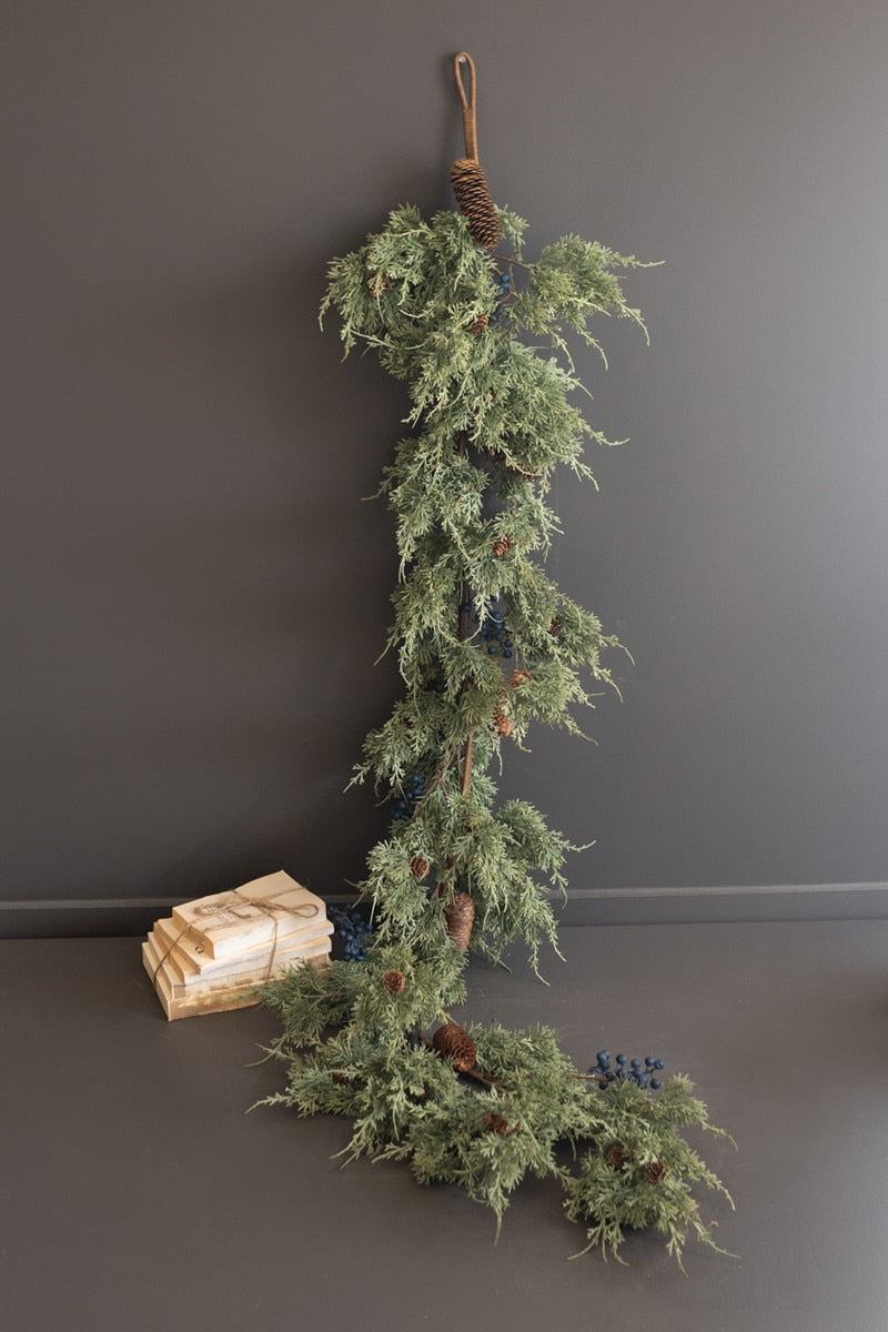 Long faux evergreen garland with pine cones