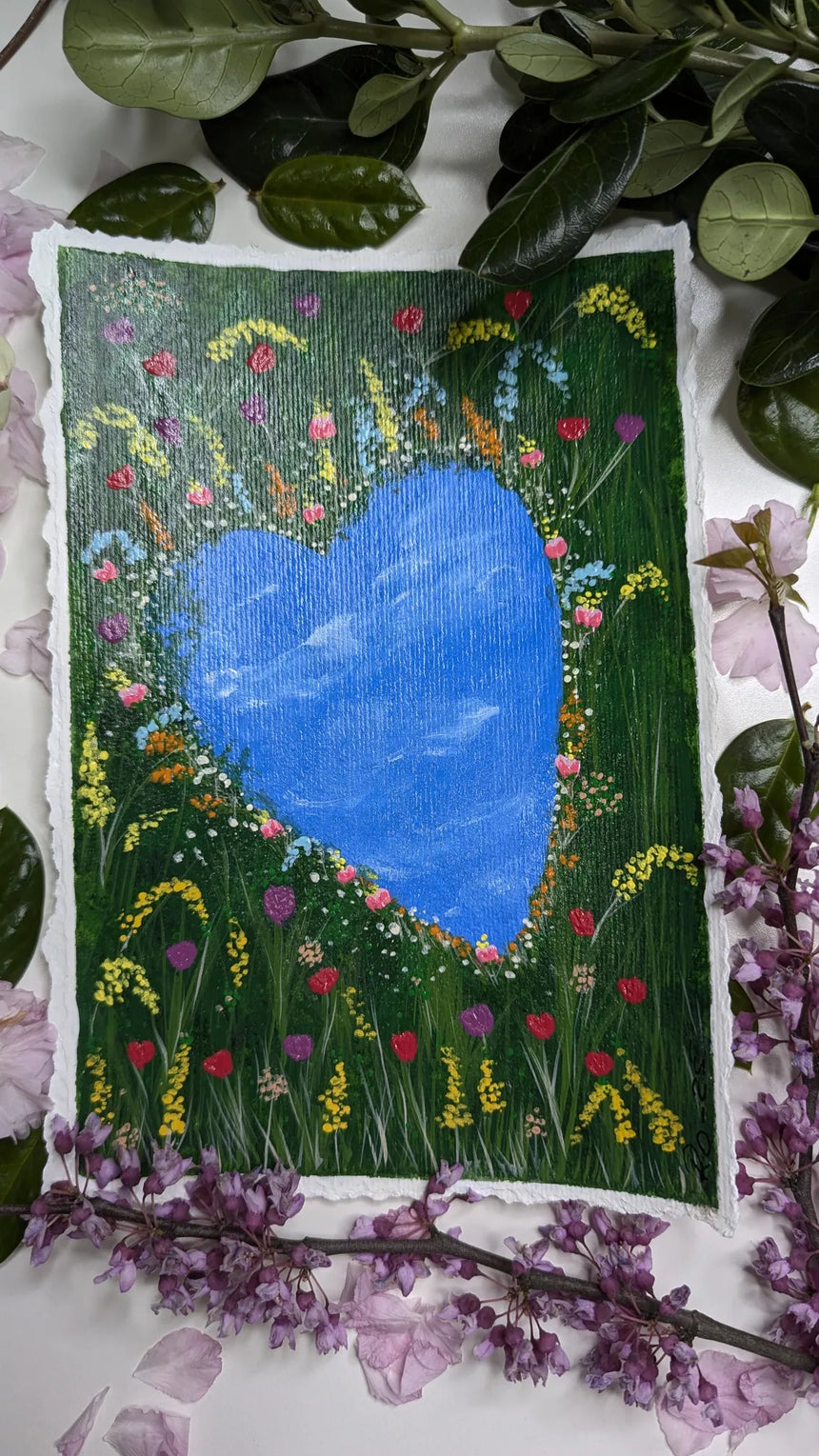 acrylic painting study of heart shaped pond amidst meadow of tulips and other flowers