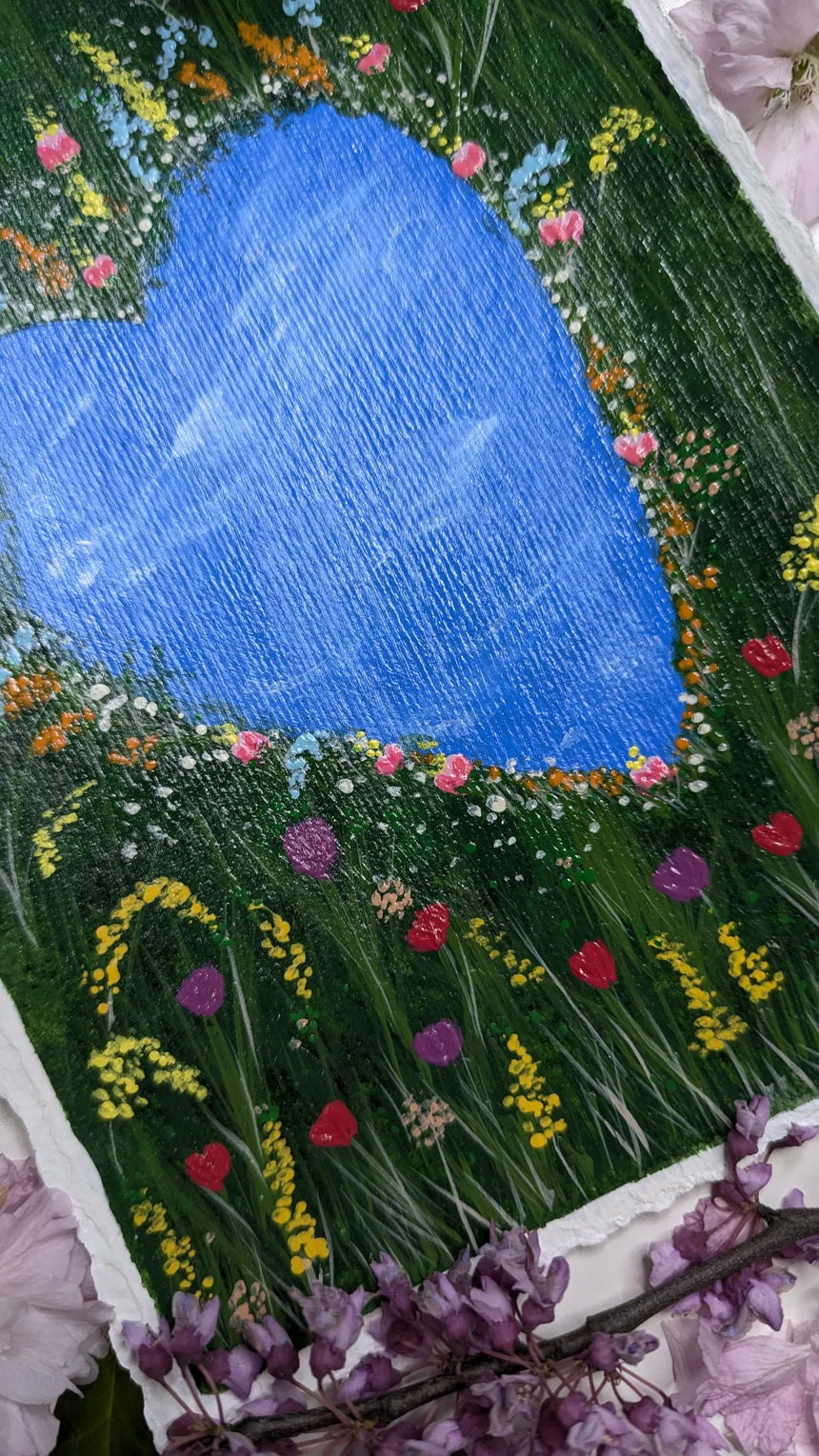 acrylic painting study of heart shaped pond amidst meadow of tulips and other flowers - slanted left view