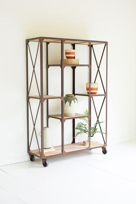 Metal shelving unit with wooden shelves against a white wall
