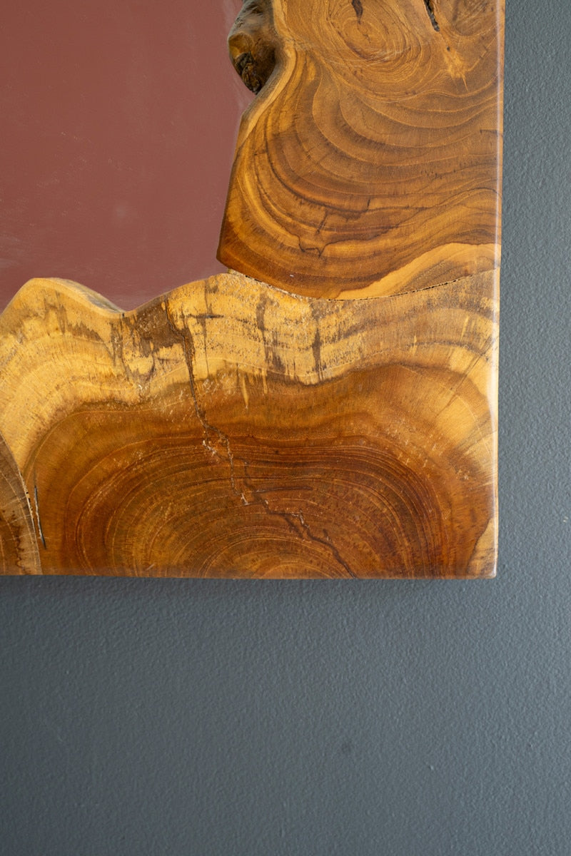 close-up of teakwood pattern at mirror edge