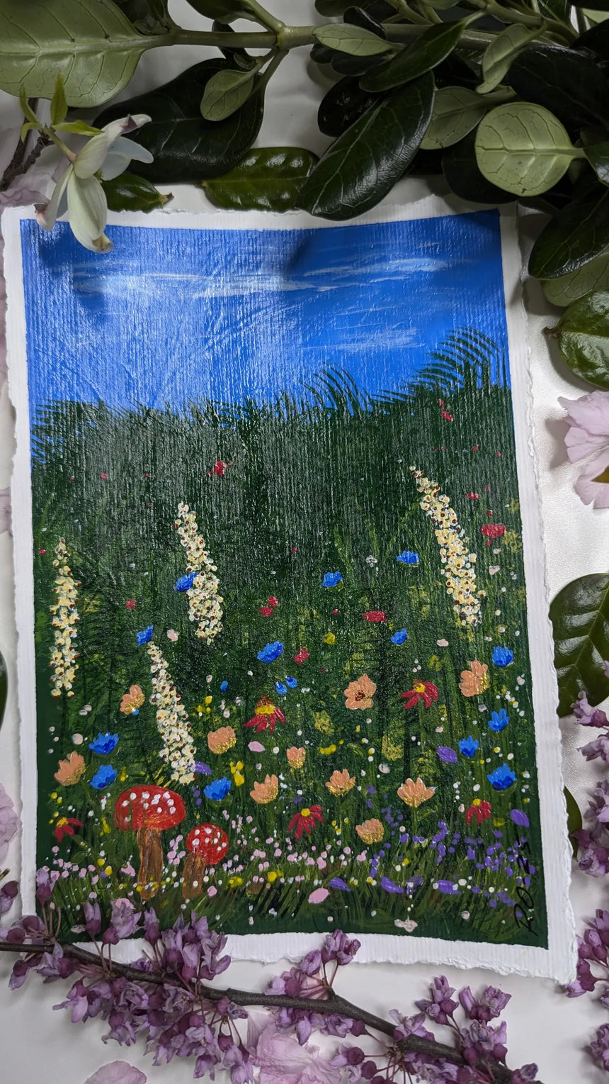 acrylic meadow painting study of wildflowers & mushrooms beneath blue sky