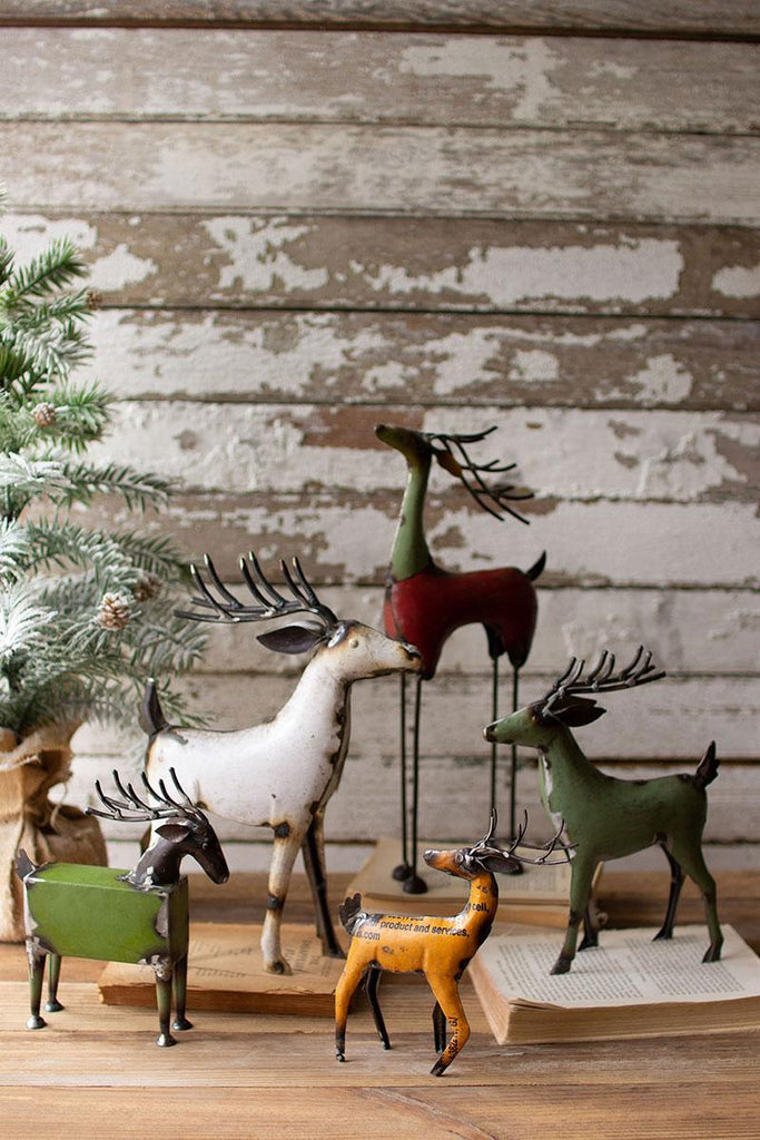 set of 5 recycled metal deer of different shapes, sizes and colors - slightly zoomed photo