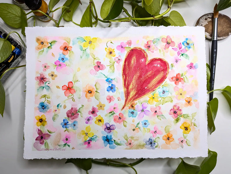 An original, hand-painted, watercolor painting featuring a red heart with vibrant array of flowers