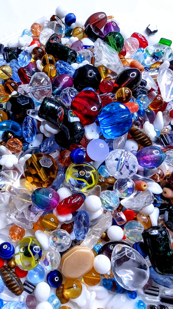 collection of jewelry making beads in different materials, colors and shapes - close-up