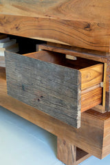 Wooden drawer unit with a rustic design on a light background