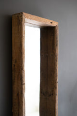 close-up of wooden frame against a gray background