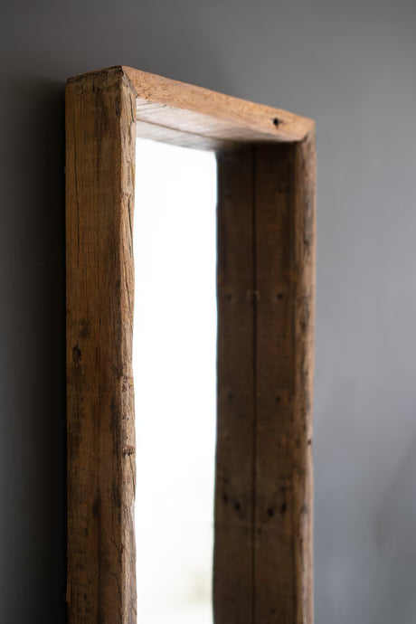 close-up of wooden frame against a gray background