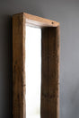 close-up of wooden frame against a gray background