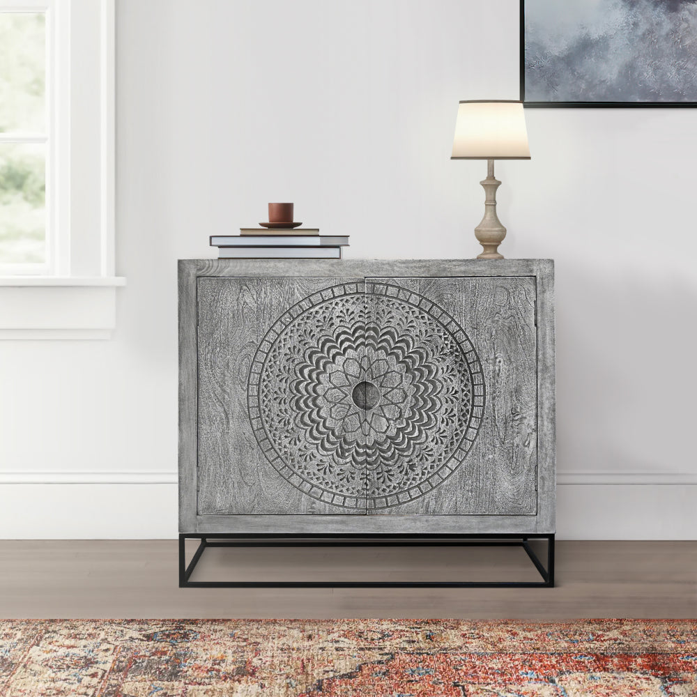 gray mango wood accent cabinet with medallion engraved doors in another living room setting