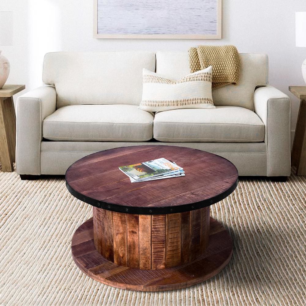 wood farmhouse coffee table in living room setting - in front of sofa