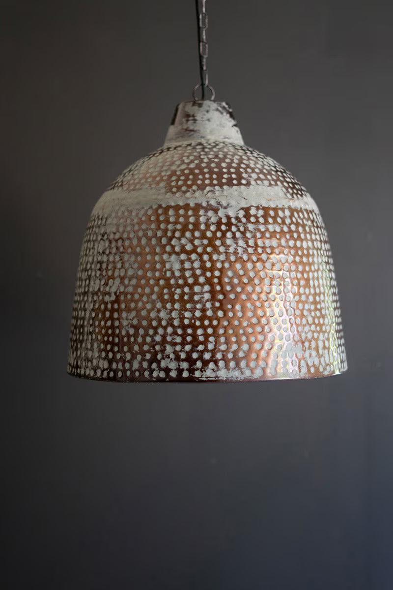Textured pendant light fixture on a dark background
