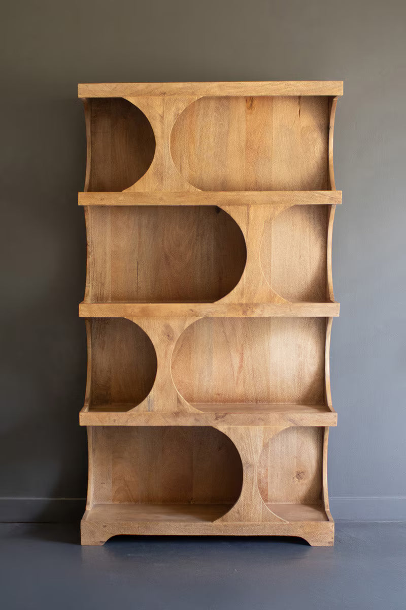Wooden shelving unit with horizontal pill-shaped shelving sections - empty standing against a gray wall