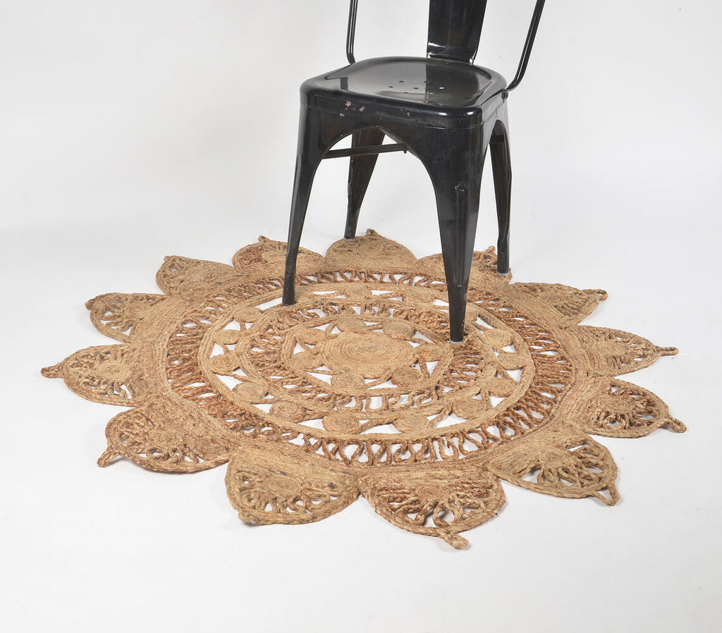 floral shaped jute rug with black chair standing on it