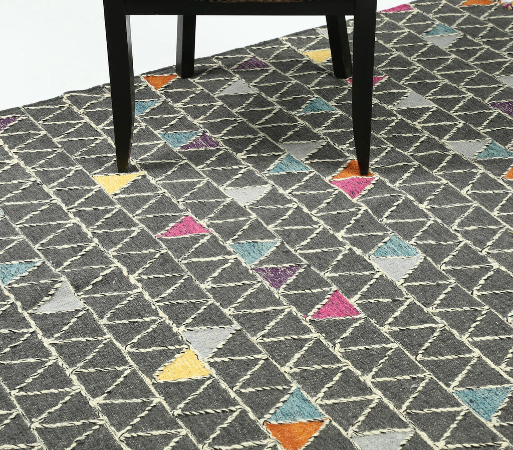 handwoven wool rug with color pop triangle design