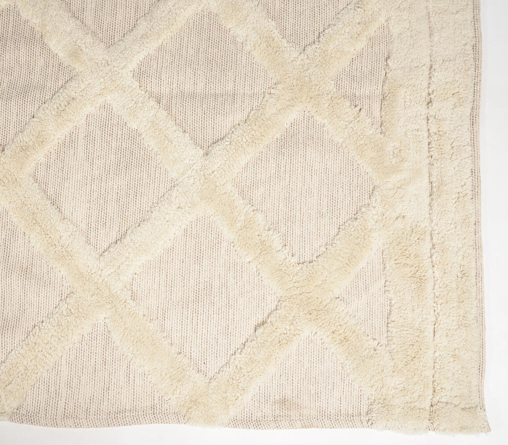 tufted beige rug's close-up of lattice design