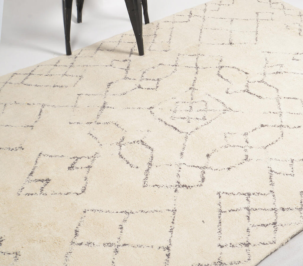 hand tufted cotton rug with varied geometric designs