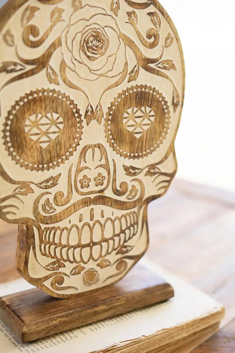 close up of calavera styled carved wood skull