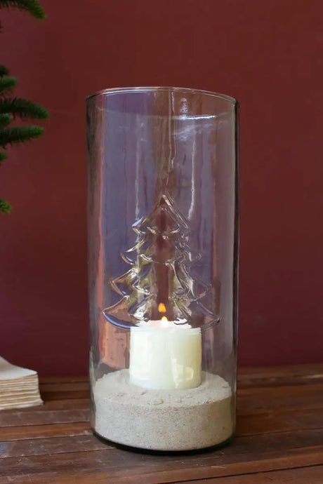 candle inside glass cylinder lights up glass embossed christmas tree