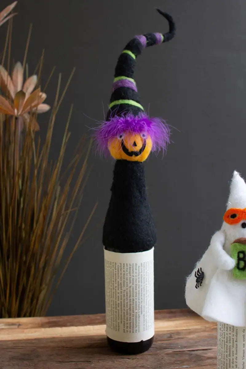 felt halloween jack-o-lantern with black purple and green ringed hat wine topper