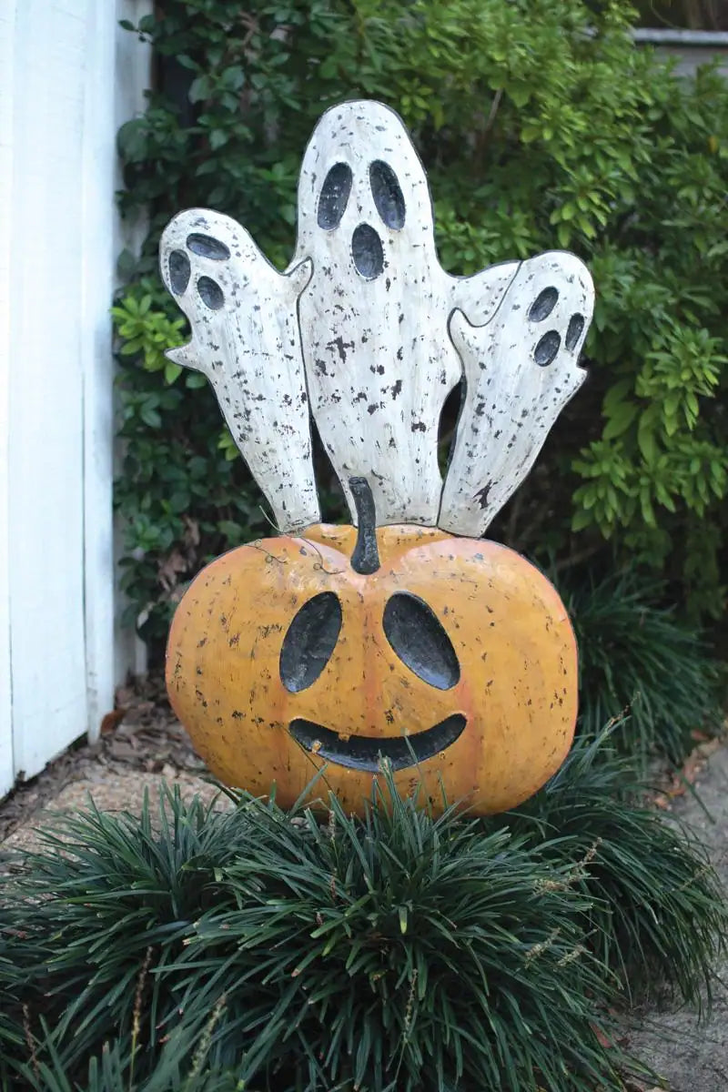 orange smiling jack-o-lantern with 3 white ghosts emerging from the top