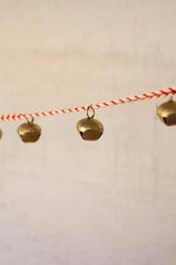 bell garland with white and red string