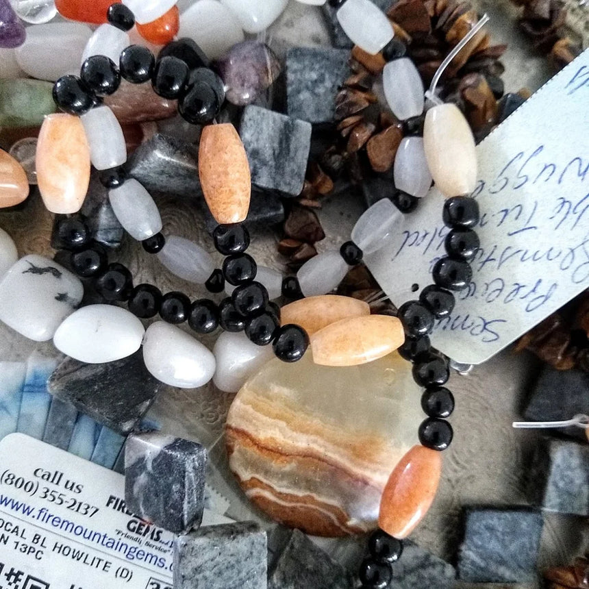 semi-precious stones on a strand labeled