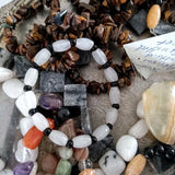 semi-precious stones on a strand labeled