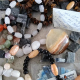 semi-precious stones on a strand labeled